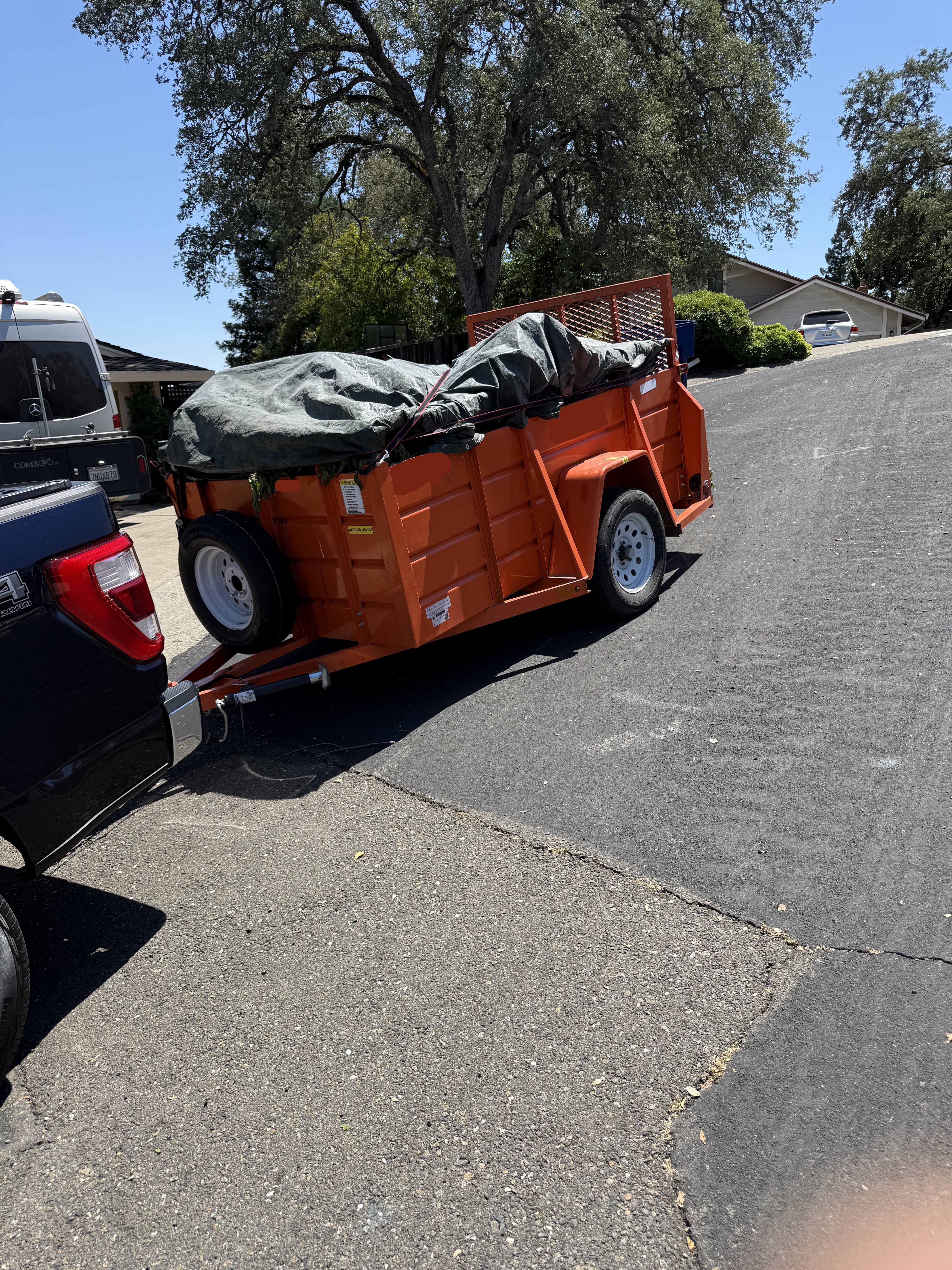 Trailer tarped and hauled away